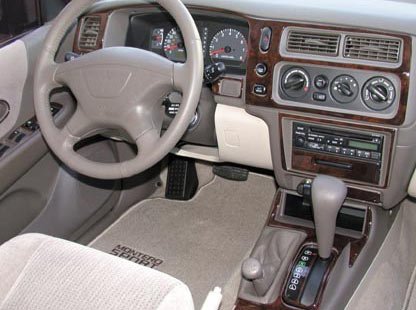 MITSUBISHI MONTERO SPORT INTERIOR WOOD DASH TRIM KIT SET 2001 2002 2003 2004 Dash Covers & Pads Mitsubishi WITH SINGLE CD PLAYER, 6CD CHANGER, AND NAVIGATION SYSTEM OPTIONS AVAILABLE