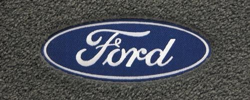 Logo 1997-1999 Ford E-150 Econoline Mid-level Custom 2 Pc Front Mats Mid-Level Cruiser Mat Color: Smoke Mat Logo: Ford Oval Applique Custom Fit Cruiser Mats CL3FA3-MC05-1YRZS:M233:L2CY